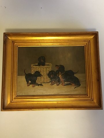 Painting, oil on canvas in gold frame, of dogs (dachshund) . Signed A. Ritzau 
1916