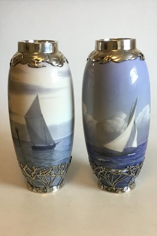 Royal Copenhagen Art Nouveau A pair of vases decorated with ship motifs and 
Sterling Silver Ornaments Stamped Michelsen ER 1916 No 1438/763 and 1462/763