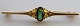 Georg Jensen Brooch in gold with green stone. Dates to 1904-1914.