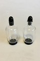 Orrefors Simon Gate Two small Bottles of glass with black base and cork of black 
glass