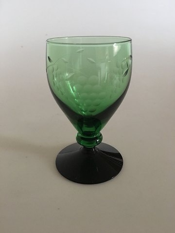 "Jane" Blackfooted White Wine Glass with Green Bouquet and ingraved grapes. 
Holmegaard.