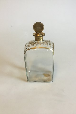 Square decanter with gilded cork