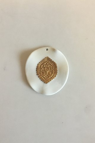 Royal Copenhagen Pendant of porcelain with gold decoration. Designed by Nils 
Thorson