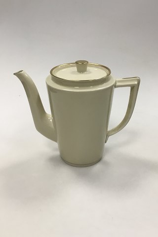 Royal Copenhagen Plain Creme pattern with gold rim Coffee Pot No 9533. Measures 
19 cm (7 31/64 in).