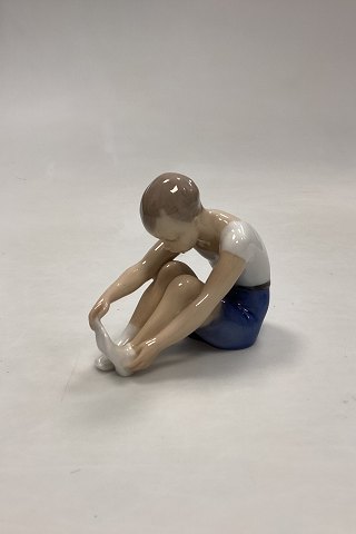 Bing and Grøndahl Figurine Boy taking  sock off  No. 2199