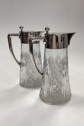 A pair of Hespe Glass Carafes with silver mountings