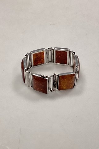 Bracelet in Sterling Silver decorated with pieces of amber
