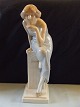 Royal Copenhagen Figurine Woman on a stone Seat No 568