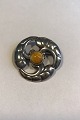 Brooch Sterling silver with amber center in foliate decoration