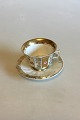 Faceted coffee cup decorated with roses and gold. Probably German