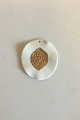 Royal Copenhagen Pendant of porcelain with gold decoration. Designed by Nils 
Thorson