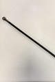 Walking cstick in black lacquered wood with silver handle