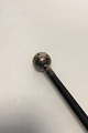 Walking stick of black lacquered wood with round silver handle with crown