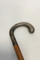 Antique elm wood walking stick with engraved silver handle stamped 830.