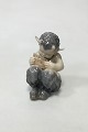 Royal Copenhagen Figurine of Faun playing pipes No 1736