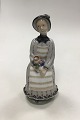 Royal Copenhagen figurine of Woman with Flowers. sifned by Georg Thylstrup No 
2156