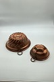 Two copper pudding molds with crown stamp