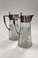 A pair of Hespe Glass Carafes with silver mountings