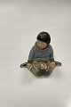 Royal Copenhagen Overglaze Figurine - Boy with Flowers from Greenland No. 12419