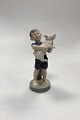 Royal Copenhagen Monthly Figurine August - Boy with Piglet No. 4530
