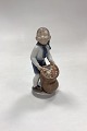 Royal Copenhagen Monthly Figurine December - Boy with Christmas Sack No. 4534