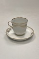 Royal Copenhagen No. 118/2005 Coffee Cup with Saucer Golden Peacock Ornament